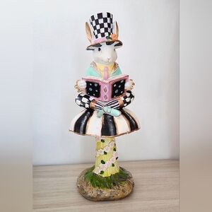 Gorgeous! Checkered, hand painted bunny sitting on a mushroom!